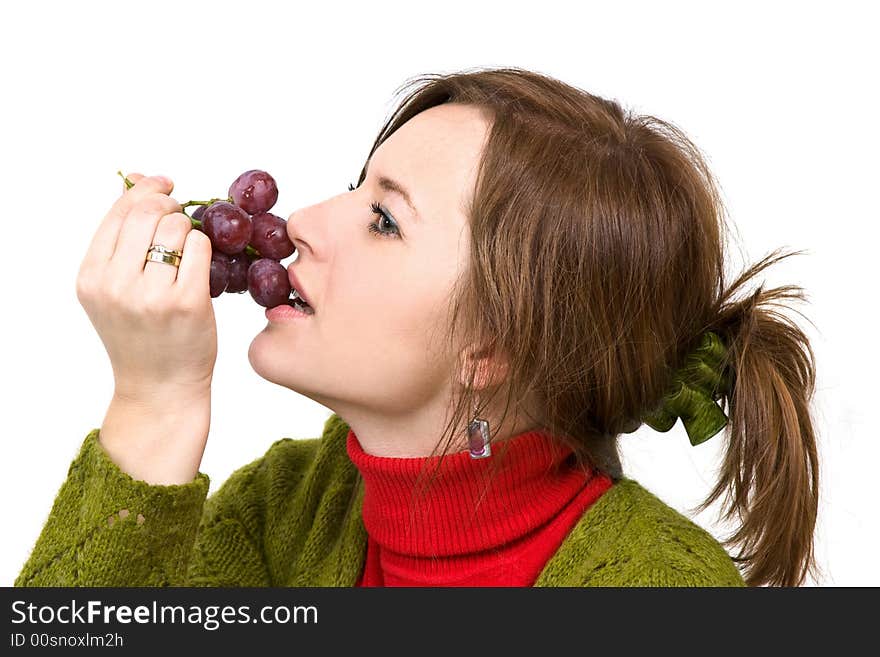 Young girl is holding grapes in the palm