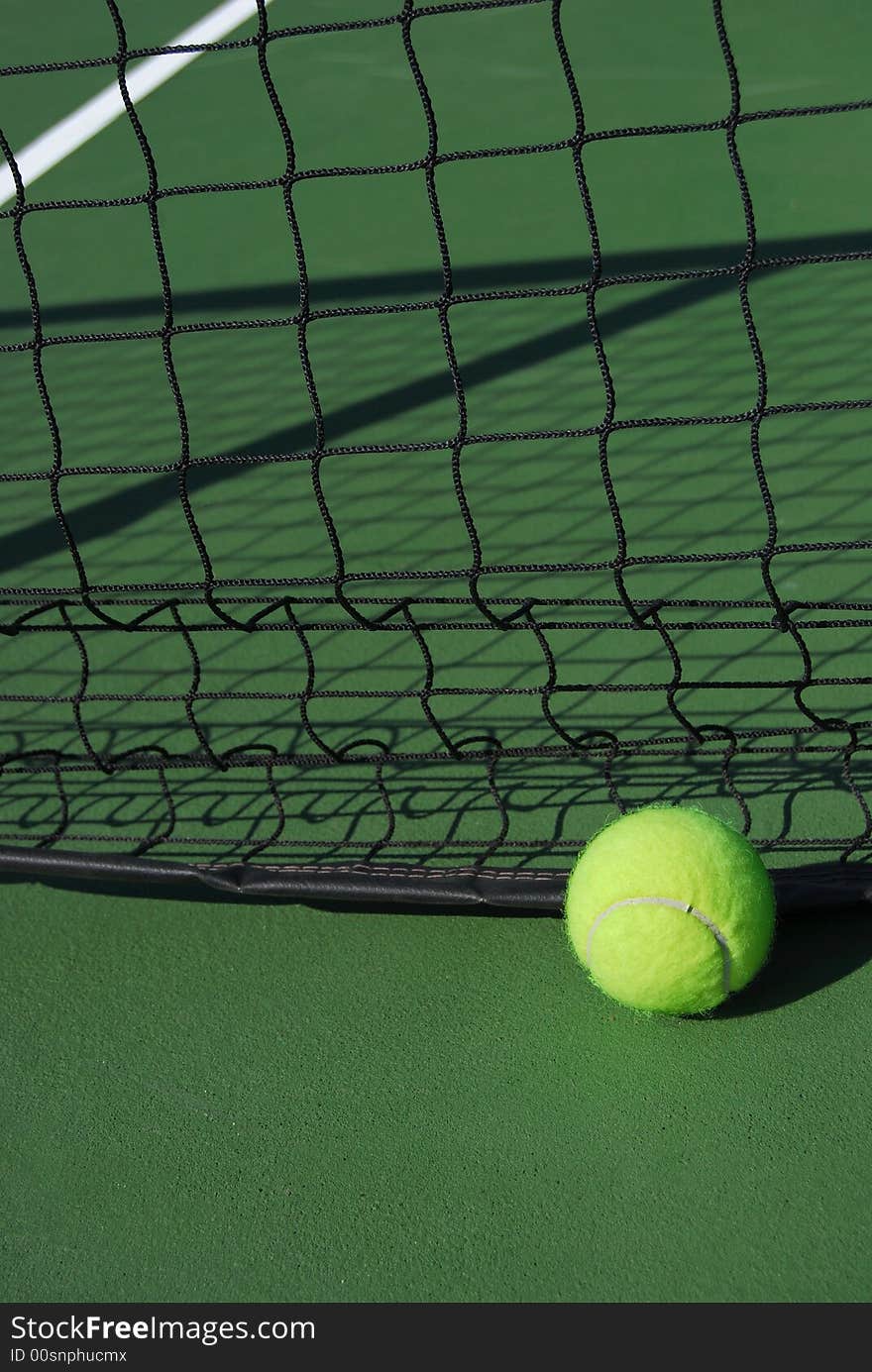 Tennis ball at the net