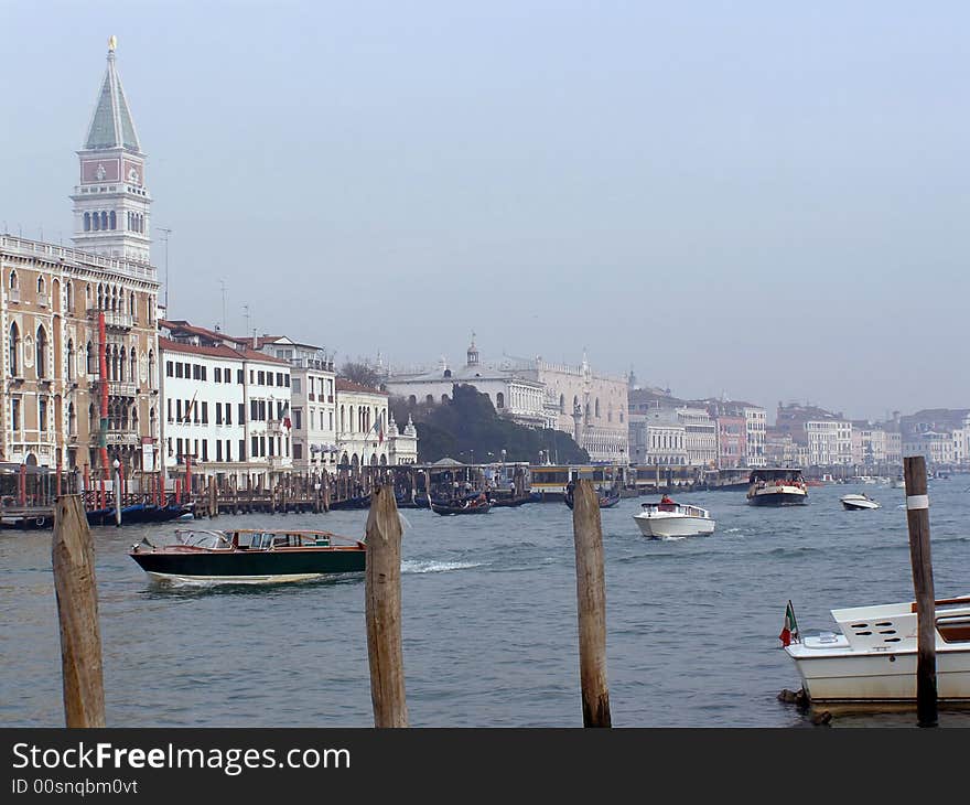 Venice, Italy: view across busy Canal Grande to Venetian palaces, Campanile San Marco (church tower) and Doge's Palace. Venice, Italy: view across busy Canal Grande to Venetian palaces, Campanile San Marco (church tower) and Doge's Palace