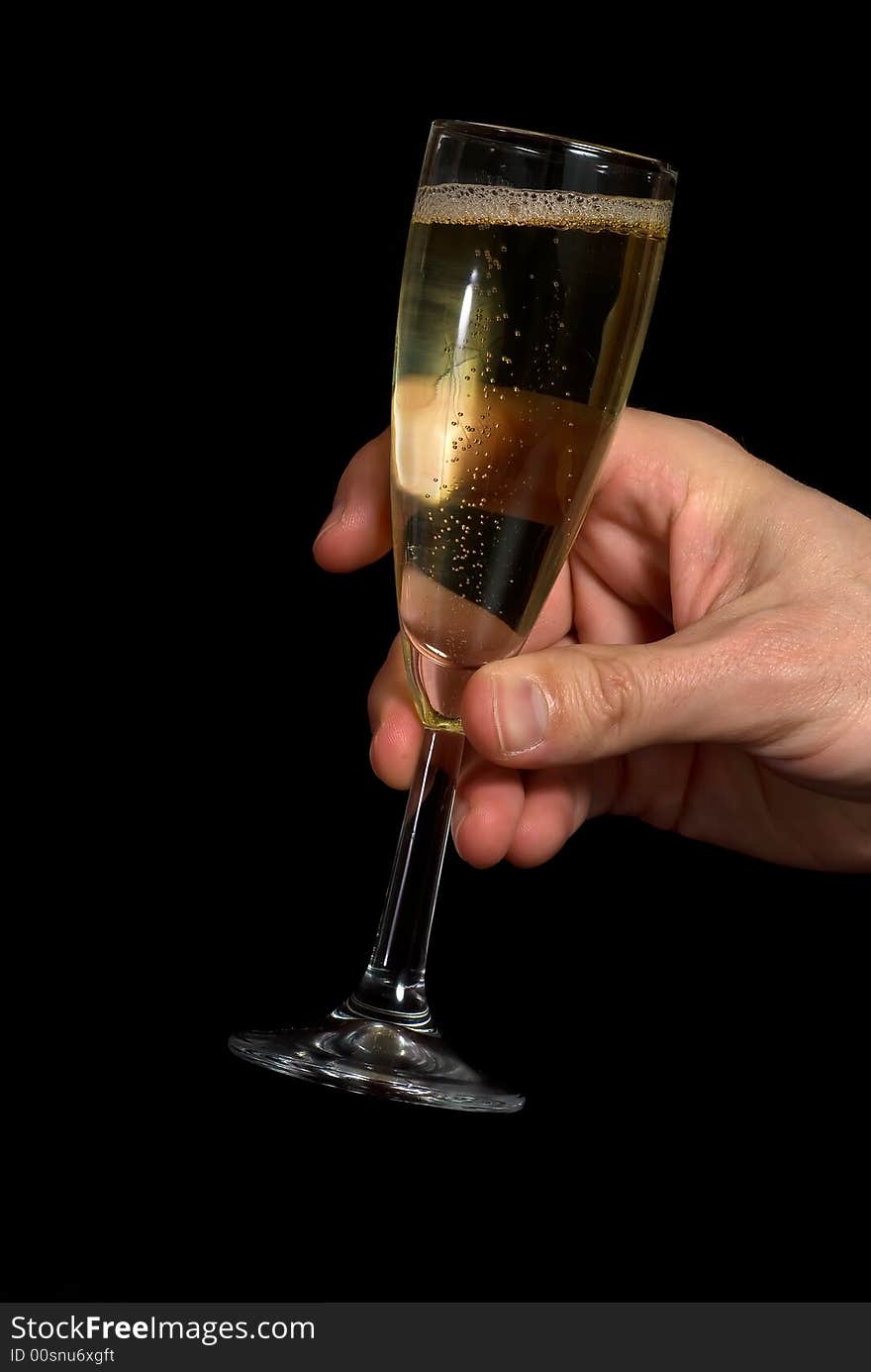 Hand taking a champagne glass. Black background. Hand taking a champagne glass. Black background.