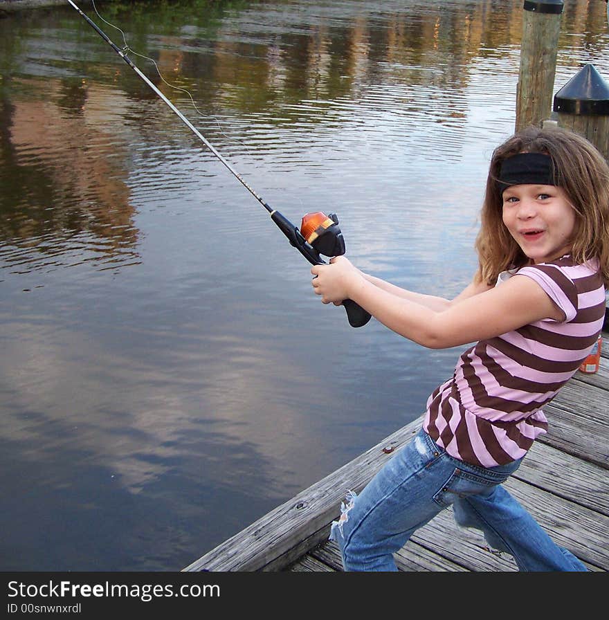 Jazzy having a blast and acting silly while fishing off dock at St. Lucie River. Jazzy having a blast and acting silly while fishing off dock at St. Lucie River