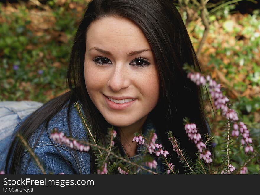 Close-up of girl lying in Spring heather