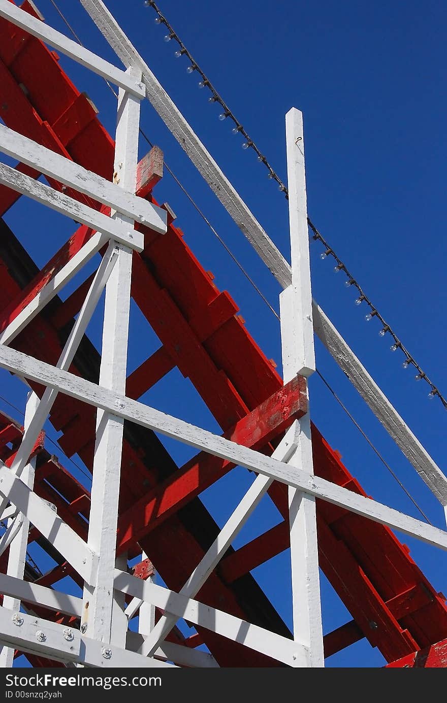 Closeup of old wooden roller coaster at the beach boardwalk. Closeup of old wooden roller coaster at the beach boardwalk.