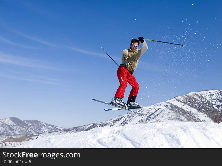 Snow Skier Jumping over Blue Sky