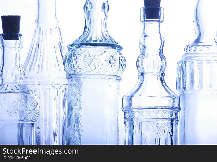 Bottles illuminated against a white backdrop.