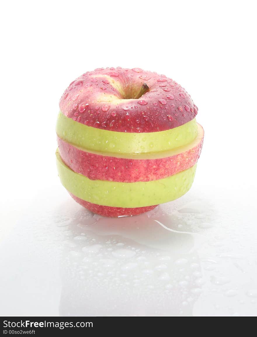 Wet striped apple on a white background