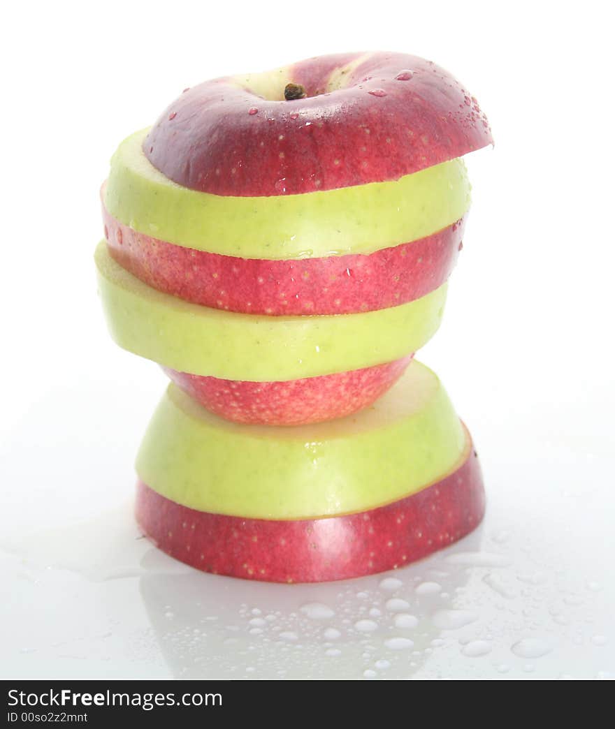 Wet striped apple on a white background