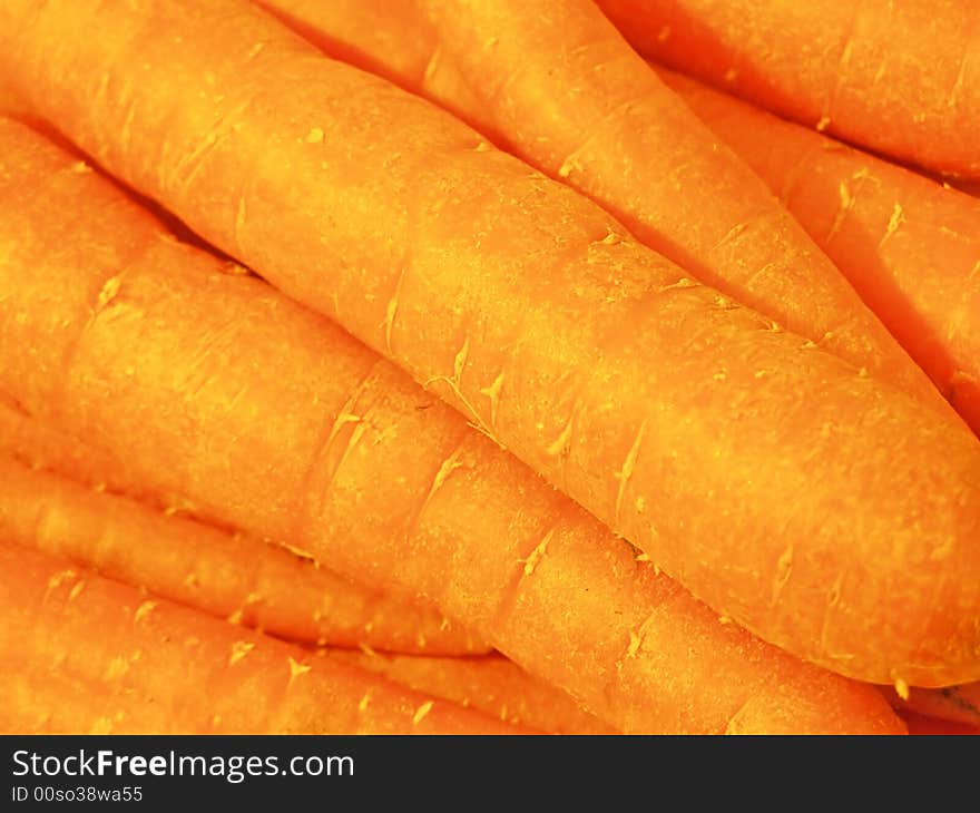 Tray of carrots in the green grocer's store, close-up isolated image;  RAW format available. Tray of carrots in the green grocer's store, close-up isolated image;  RAW format available