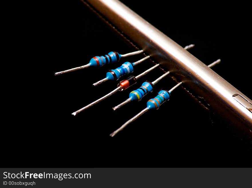 One diode and some resistors isolated on black