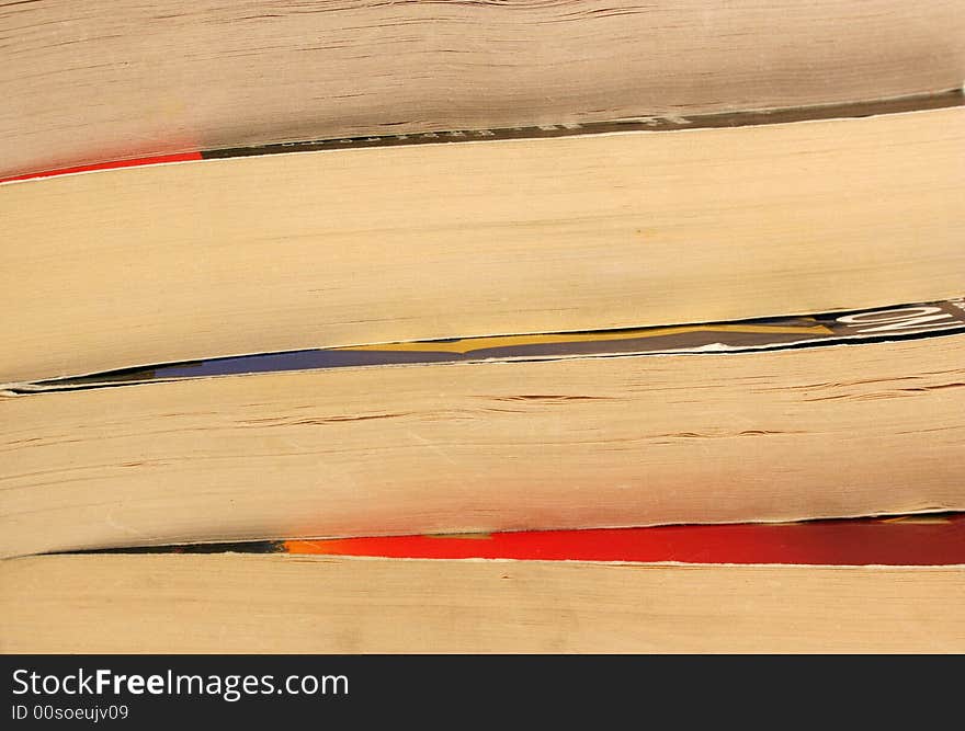 A Four stacked paperback books background image