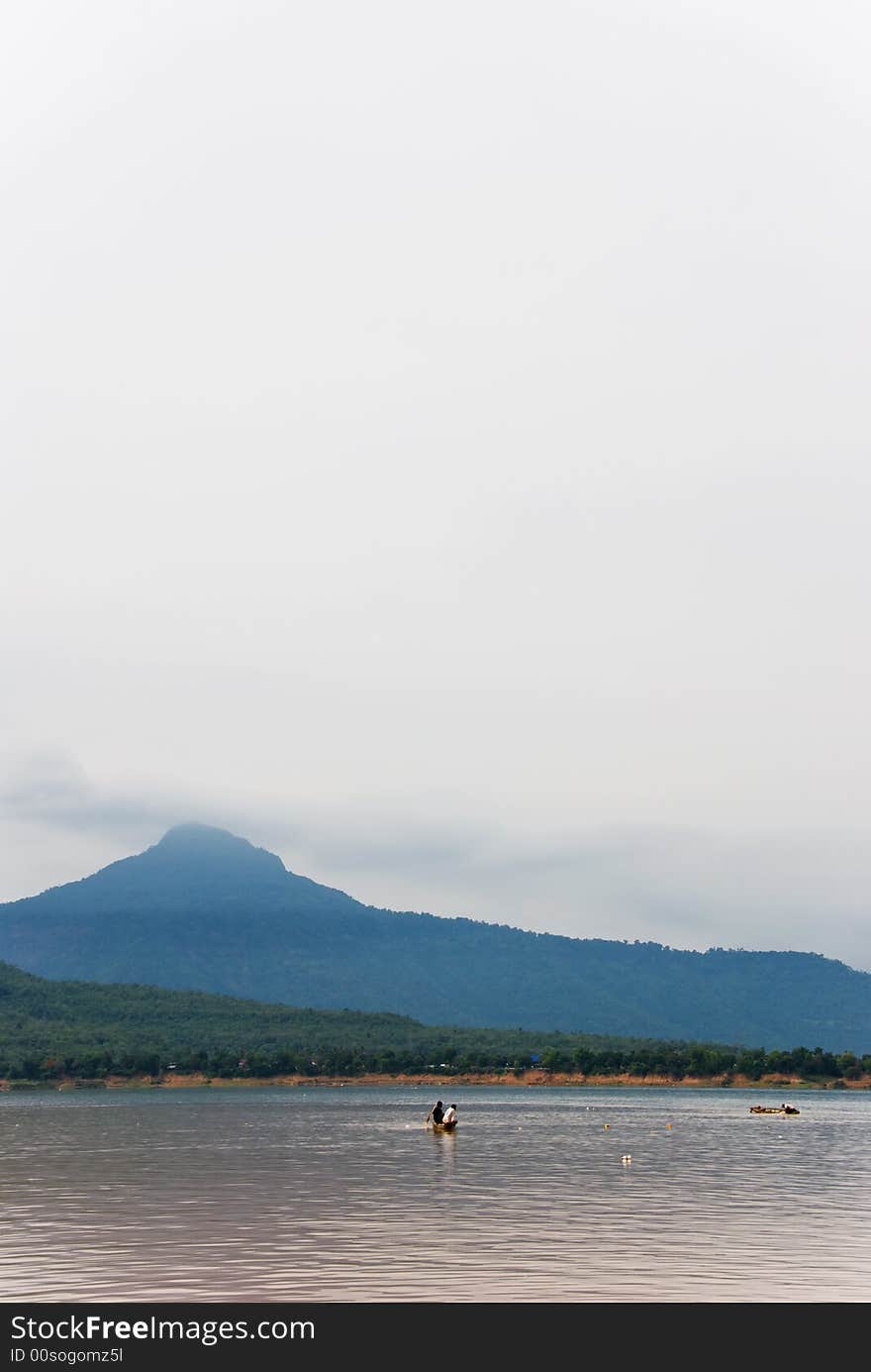 Mekong river with boatmen on a canoe. Mekong river with boatmen on a canoe