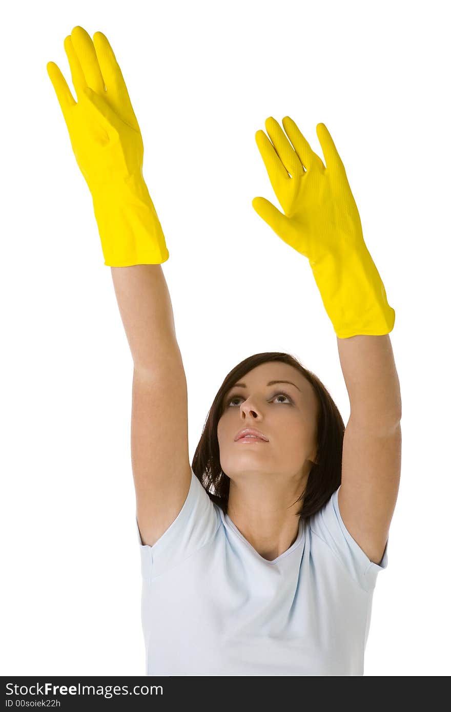 Young woman in yellow rubber gloves with raised up hands. She's reach to something. Front view, white background. Young woman in yellow rubber gloves with raised up hands. She's reach to something. Front view, white background.