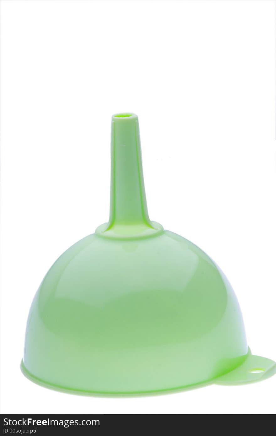 Green plastic kitchen funnel on white