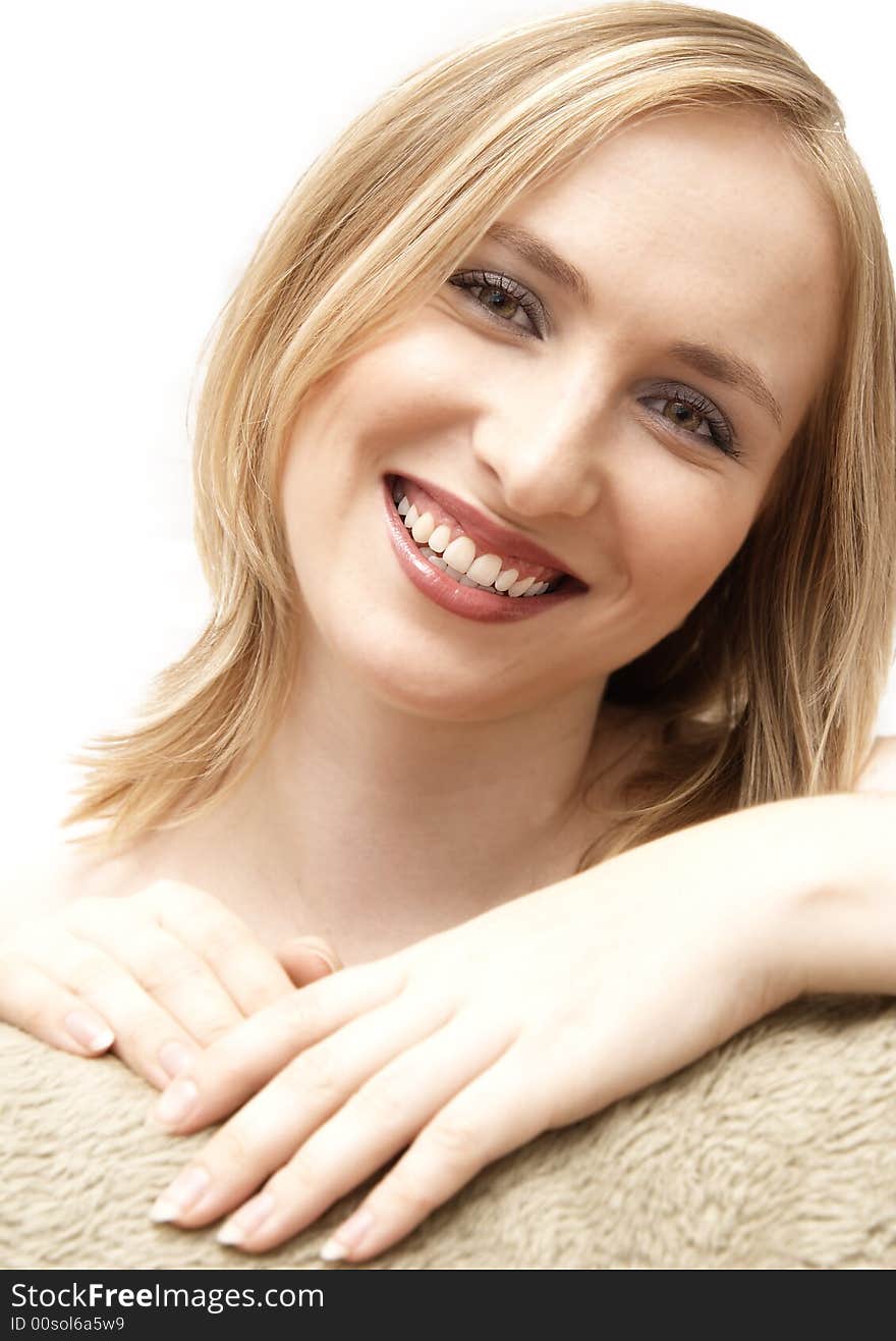 Beautiful blonde woman with bright makeup smiling