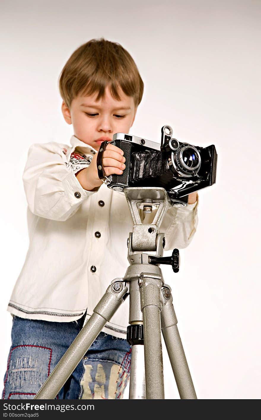 Pretty boy shooting with camera over white. Pretty boy shooting with camera over white