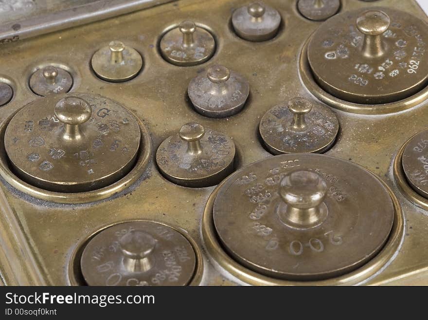 Box with an assortment of different weights brass. Box with an assortment of different weights brass