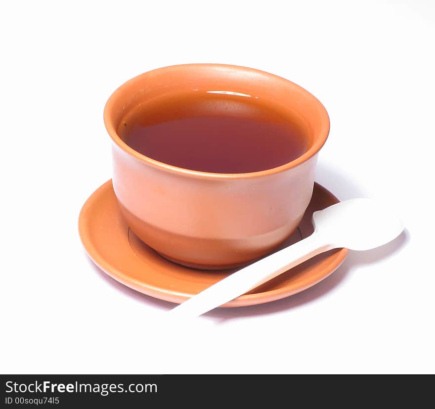 A small cup of tea on a white background