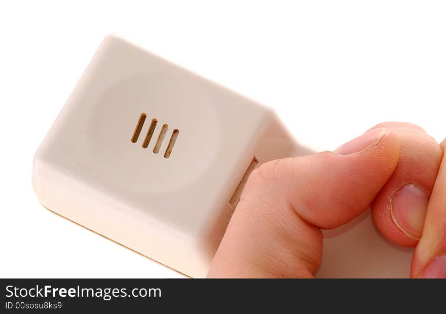 Old telephone in a hand, close-up, white background. Old telephone in a hand, close-up, white background