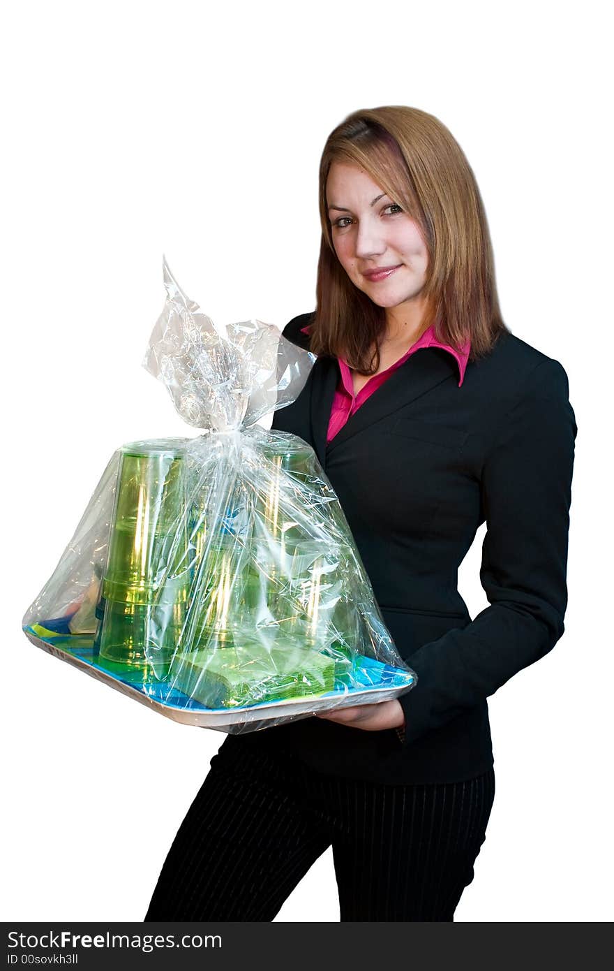 Woman in business suit carrying a wrapped gift. Woman in business suit carrying a wrapped gift