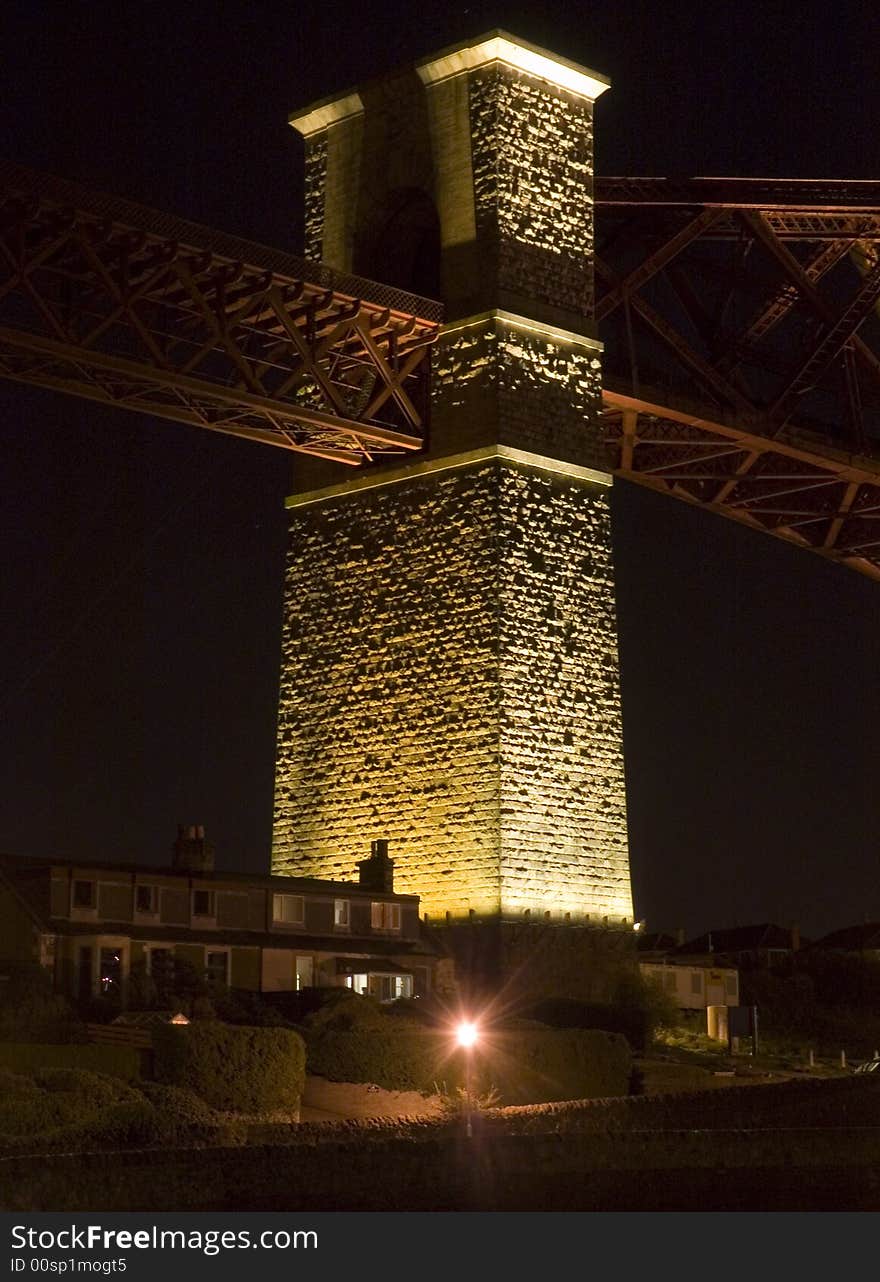 The first pillar of the forth Rail bridge north approaching. Standing tall and lit from below. The first pillar of the forth Rail bridge north approaching. Standing tall and lit from below.