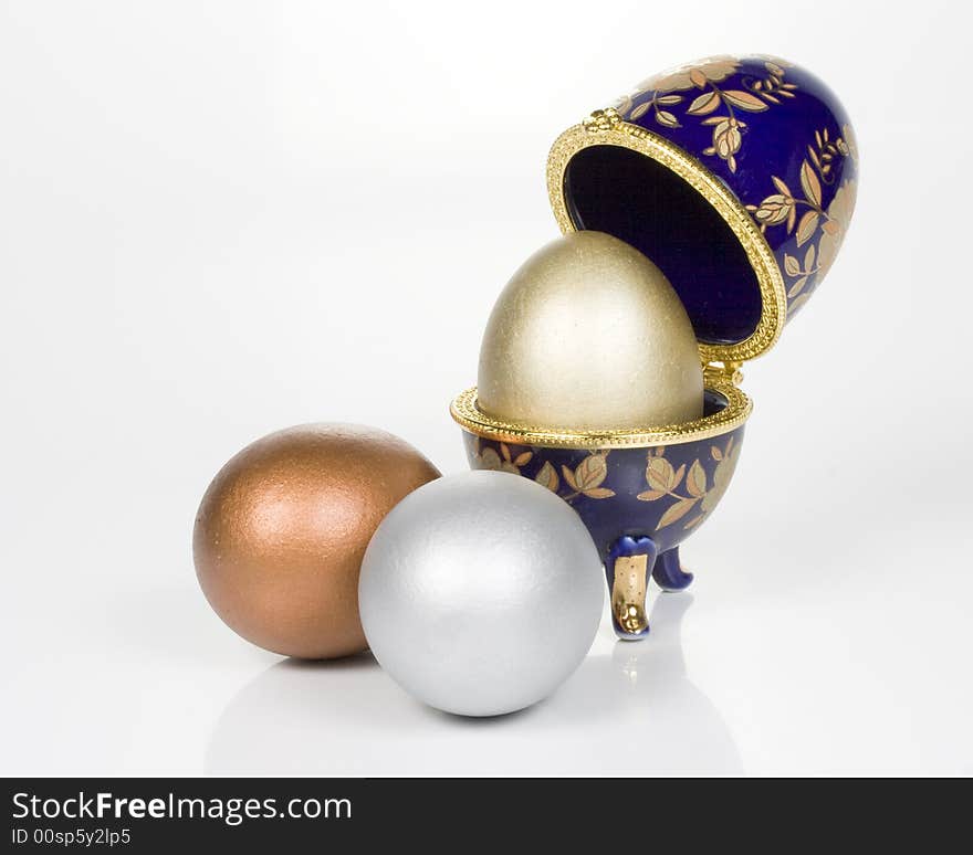 Gold egg in eggcup