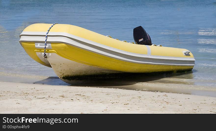 Yellow zociac dingy on island beach. Yellow zociac dingy on island beach.