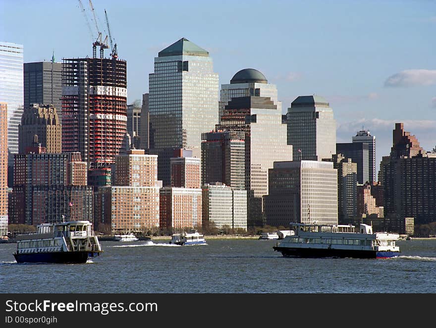 Ferry and tour boats ply the Hudson River beside Manhattan, New York City. Ferry and tour boats ply the Hudson River beside Manhattan, New York City.