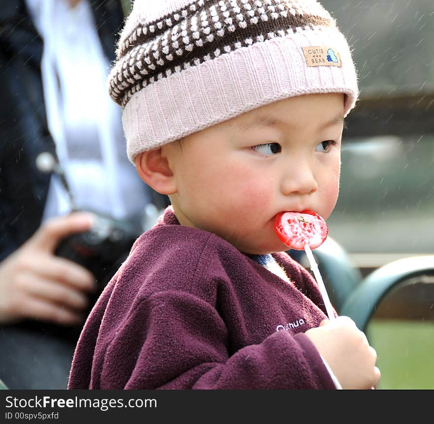 Lovely Baby And Colourful Lollipop