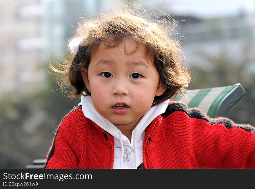 A beautiful girl in red，with smile