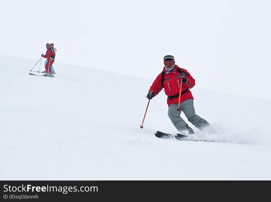 Man alpine skier running down fast