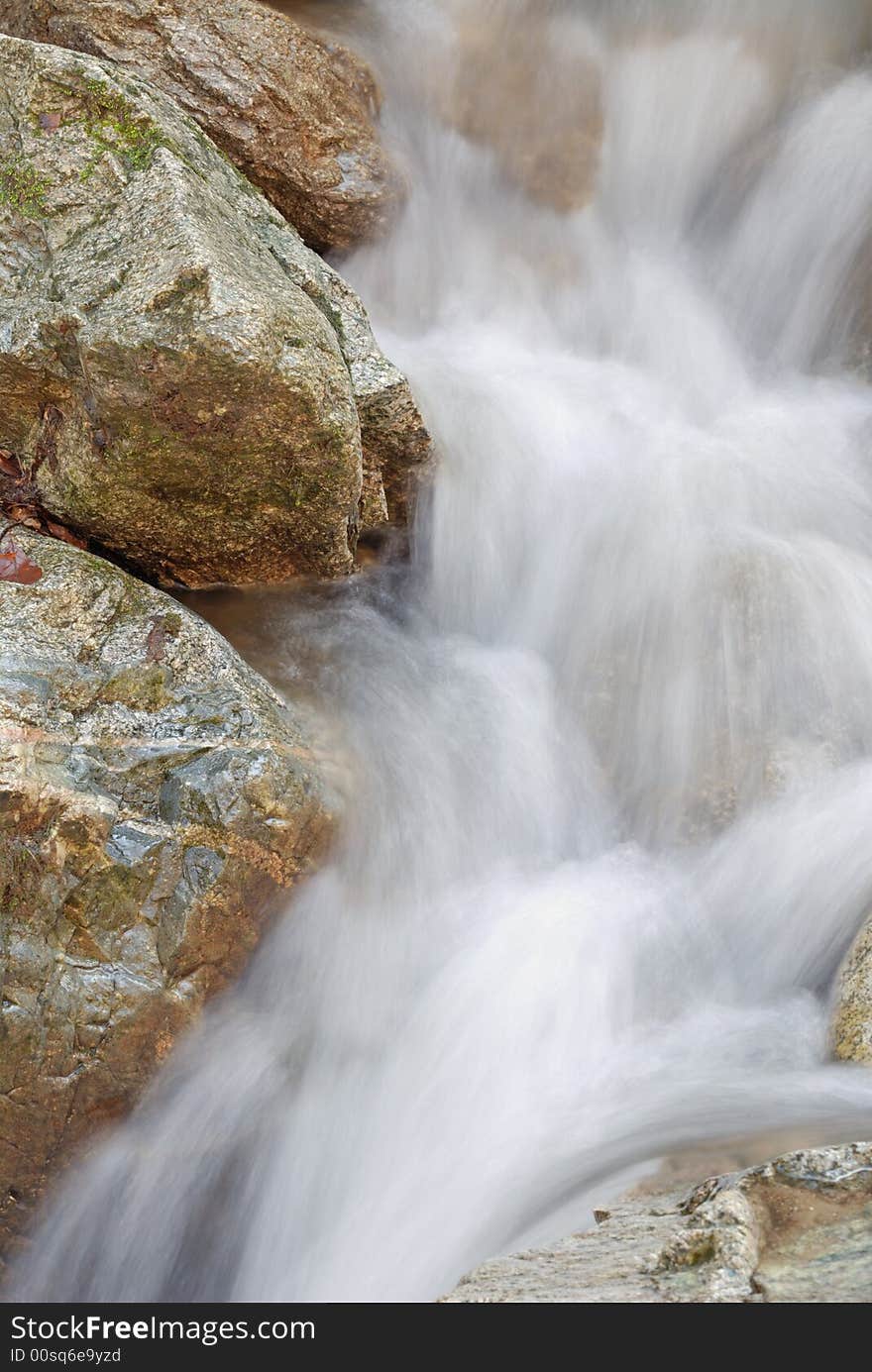 Long exposure photo of running water over rocks. Long exposure photo of running water over rocks