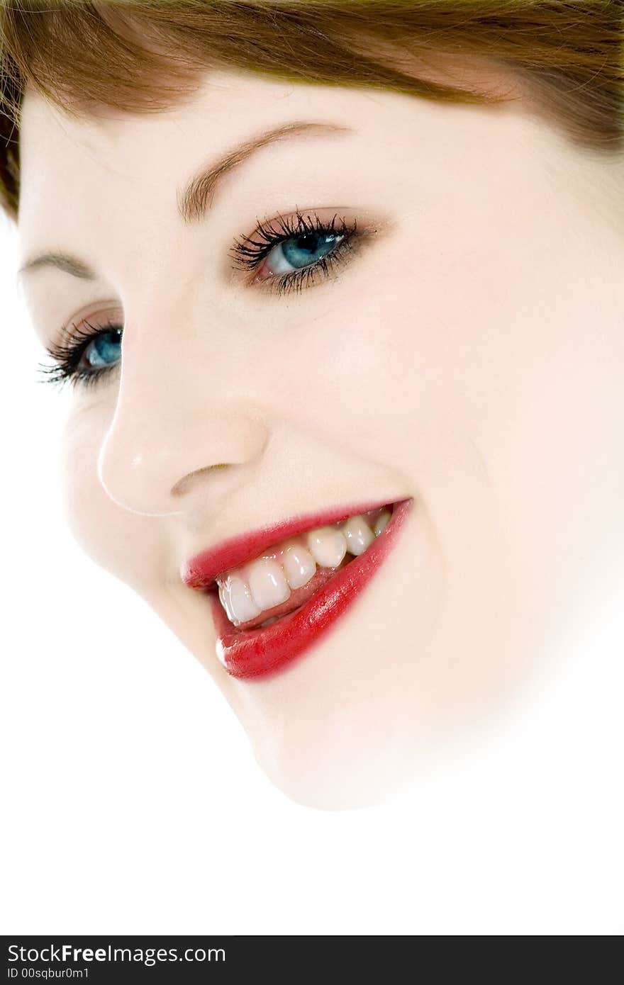 Smile of a beautiful young woman on white background