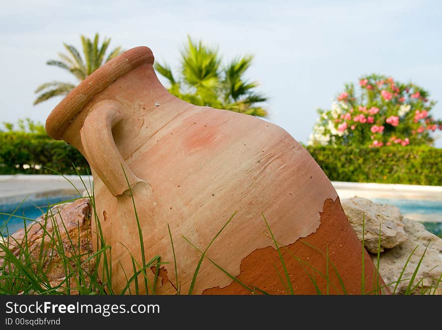 Earthenware pitcher near pool in Tunisian resort