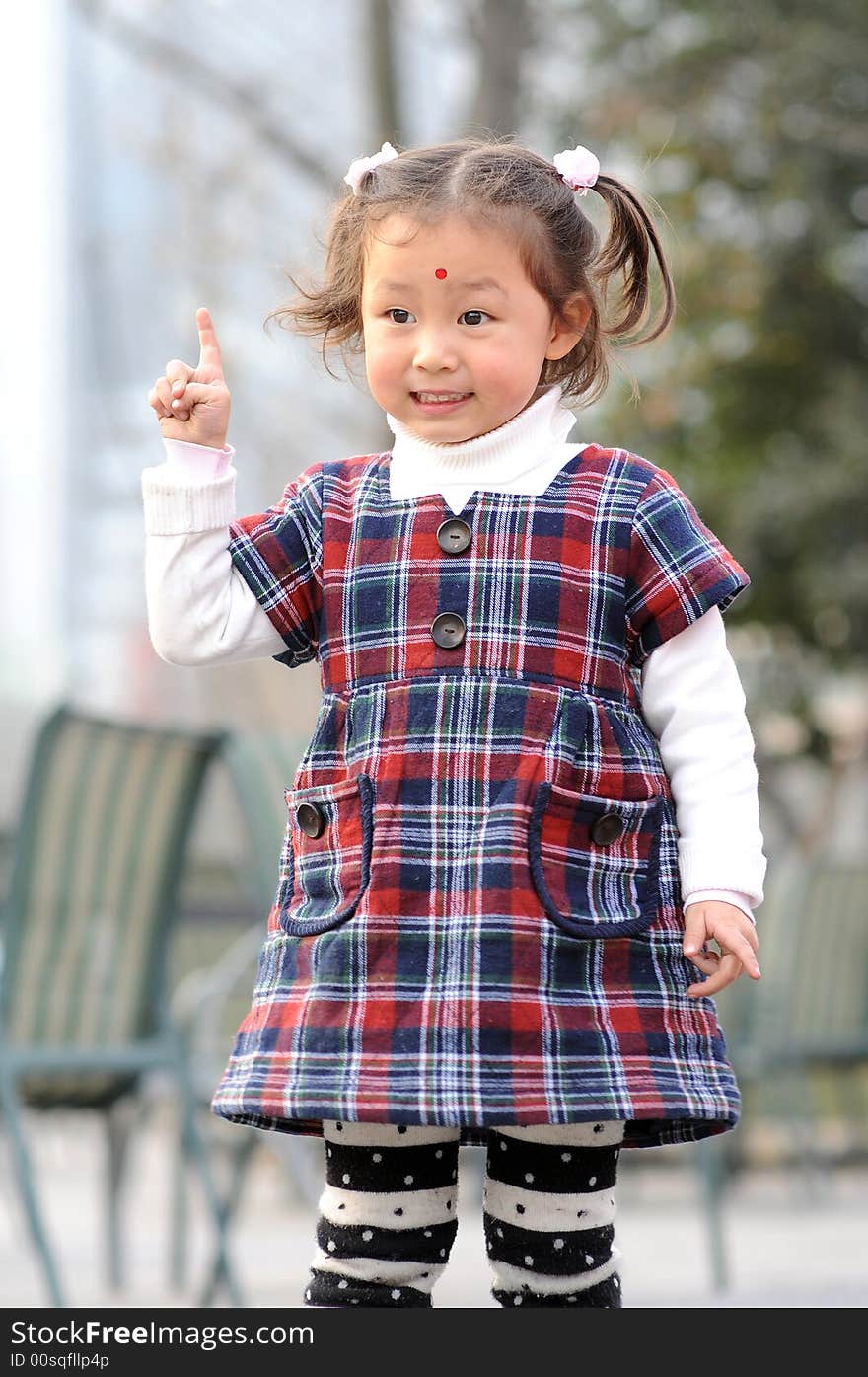 A little beautiful girl with happy smile looking at you. A little beautiful girl with happy smile looking at you.