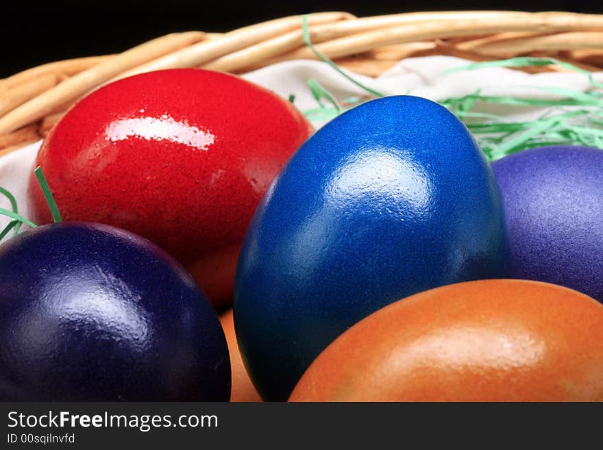 The Easter eggs are standing in basket. The Easter eggs are standing in basket