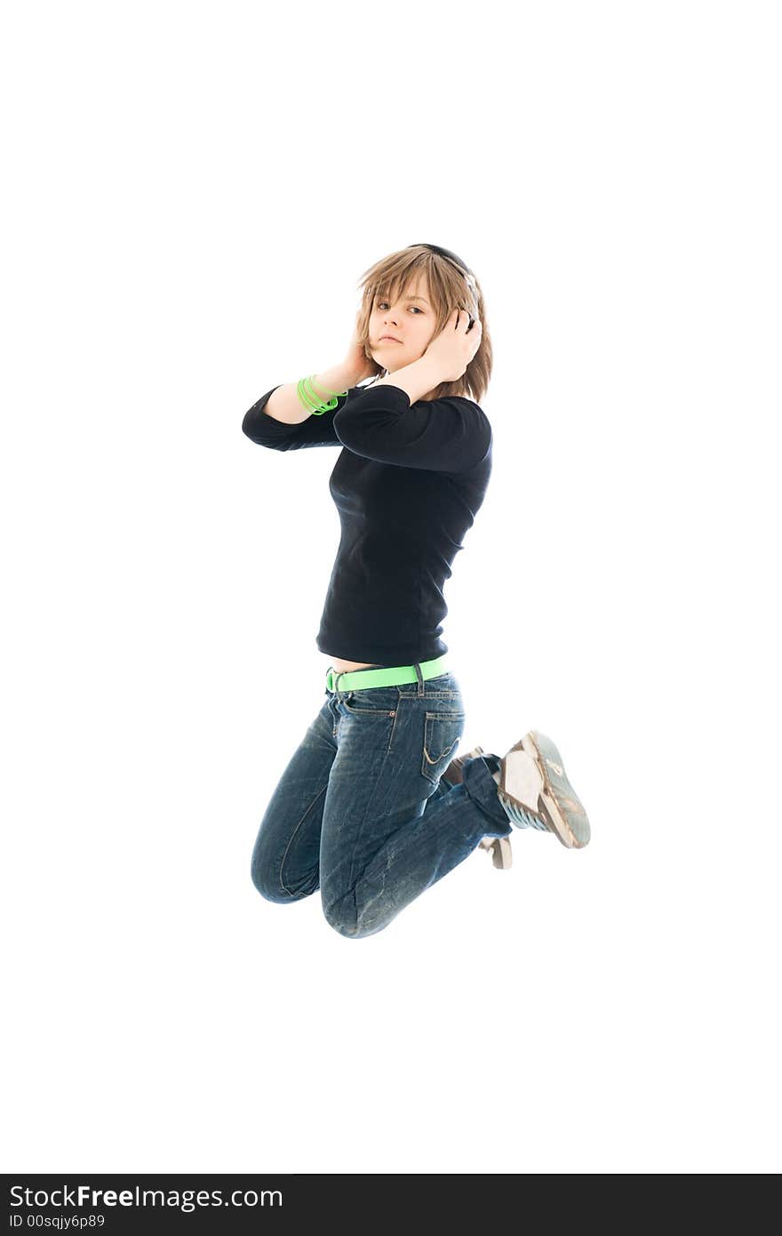 The young jumping girl with a headphones isolated on a white background