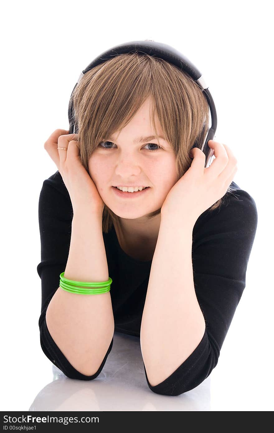 The young girl with a headphones isolated on a white background