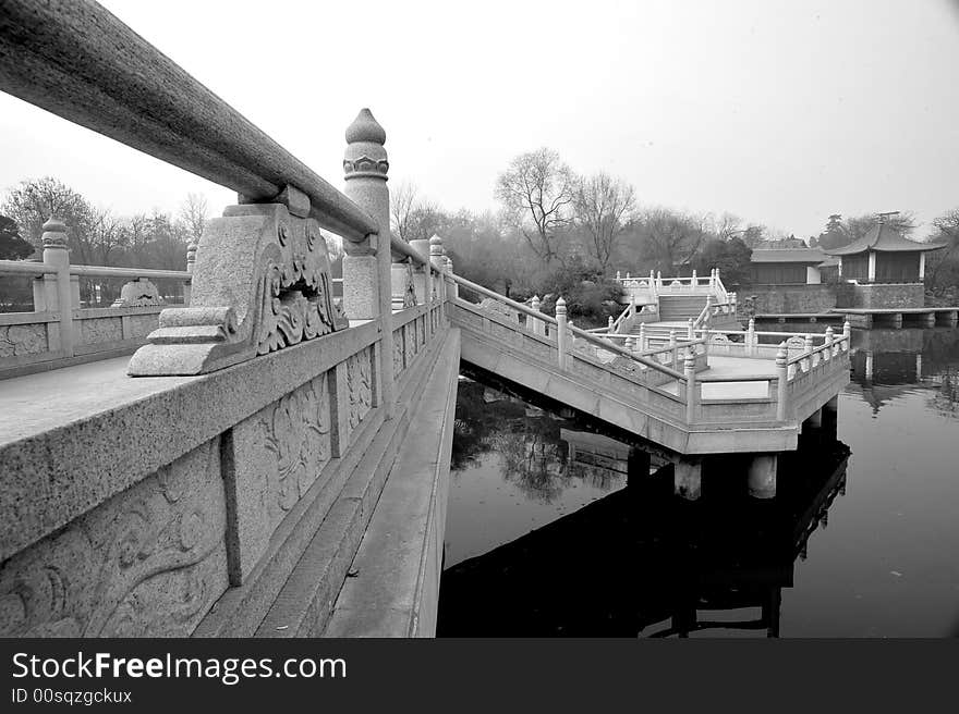 Bridges of a garden on the morning.Xian ,China.Black and white picture. Bridges of a garden on the morning.Xian ,China.Black and white picture.