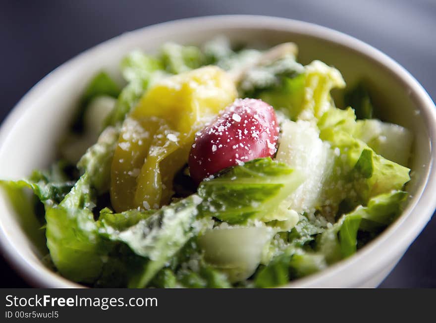 Image of italian salad topped with parmesean cheese