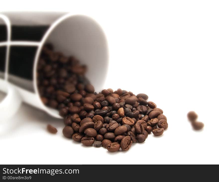 Coffee beans in a white cup