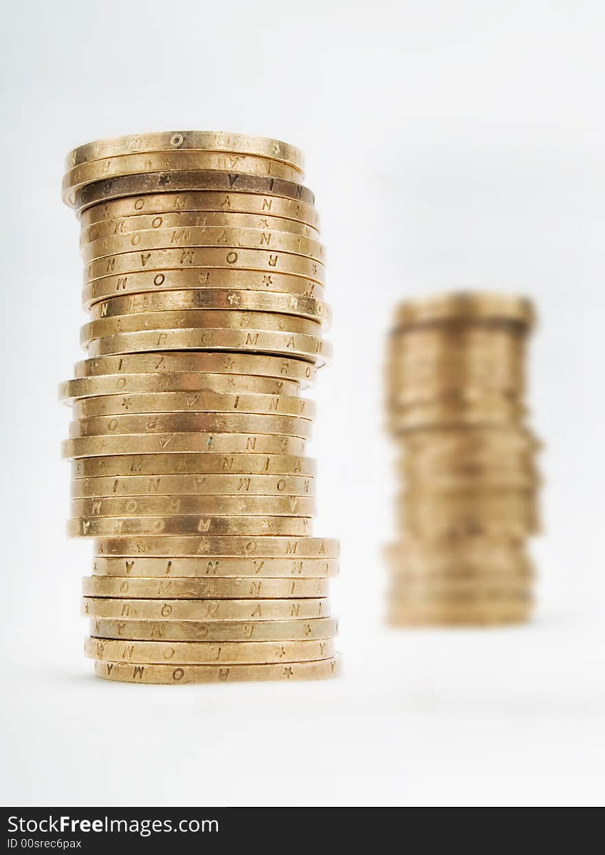 Piles of coins on a white background