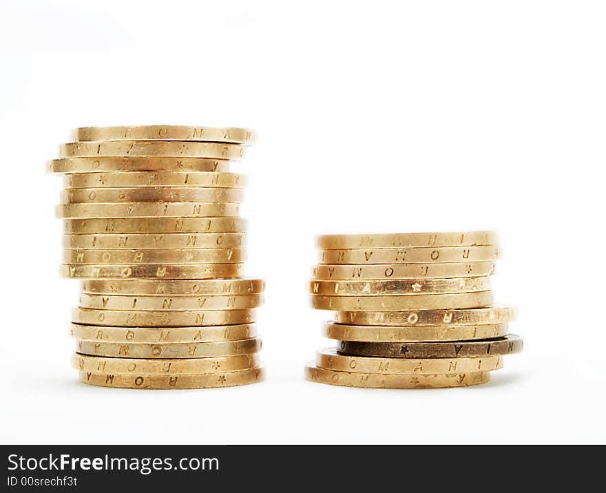 Piles of coins on a white background