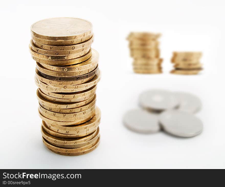 Piles of coins on a white background