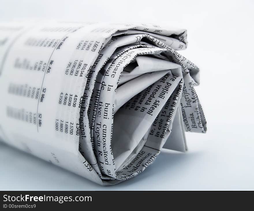 Roll of newspaper on a white background