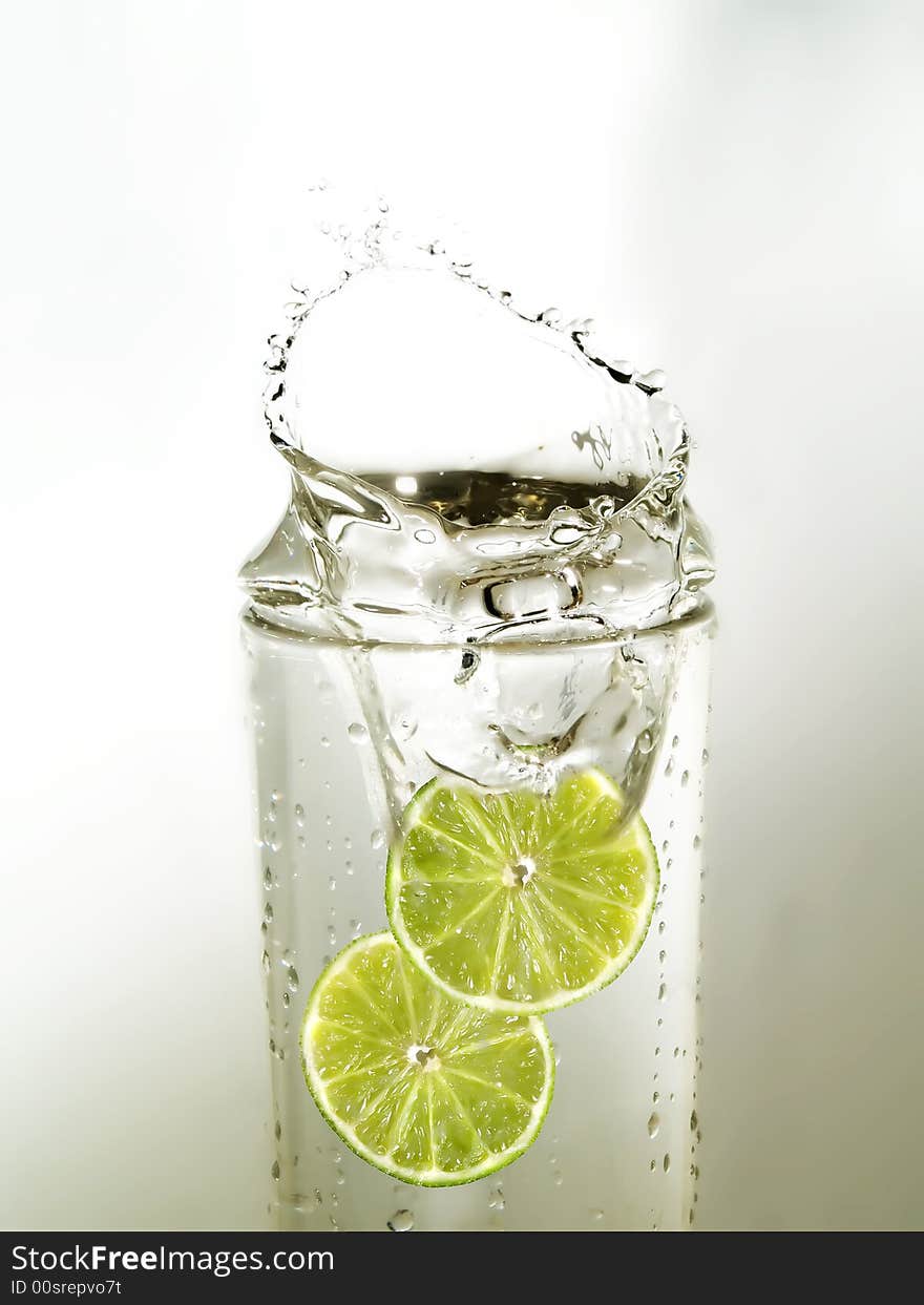 Lime slices in a glass of water. Lime slices in a glass of water