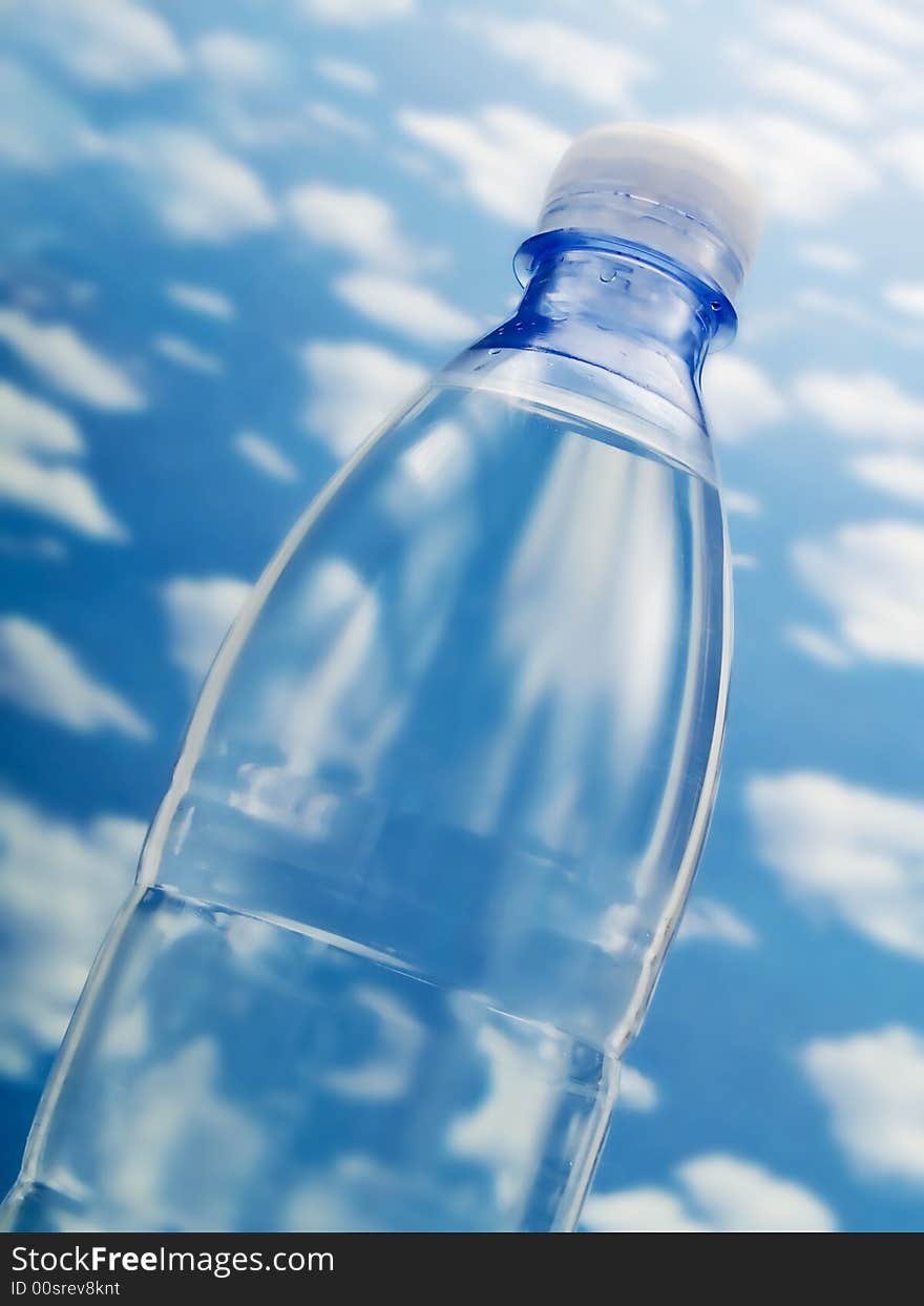 Bottle of water on a blue sky