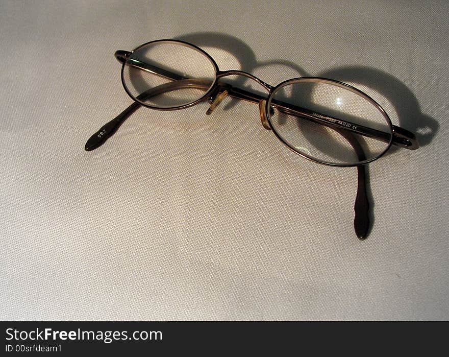 Small woman's glasses on a white background. Small woman's glasses on a white background