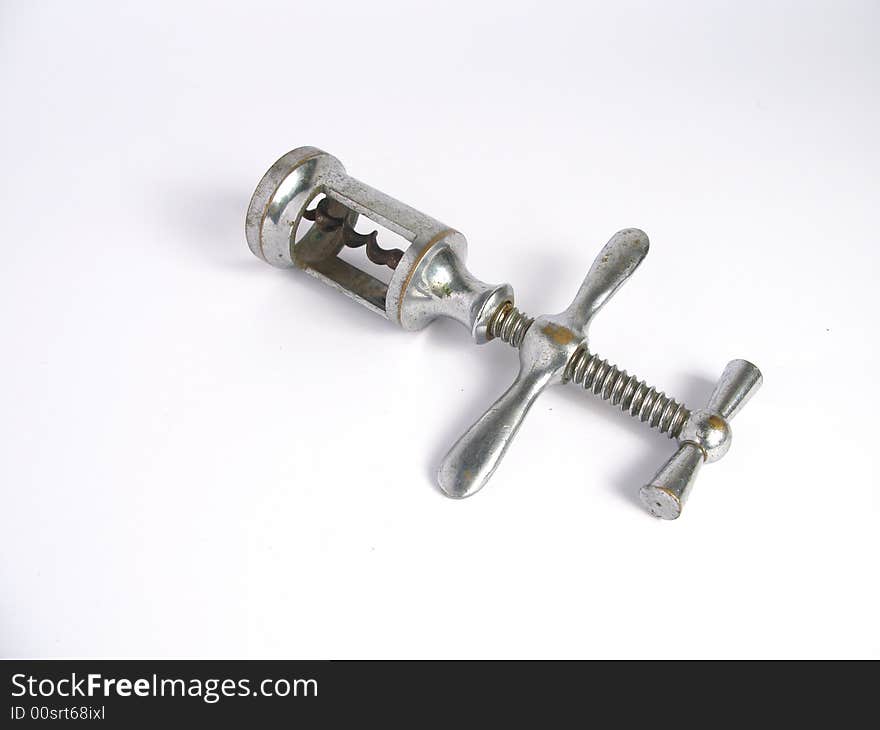 Isolated retro rusty corkscrew on white background