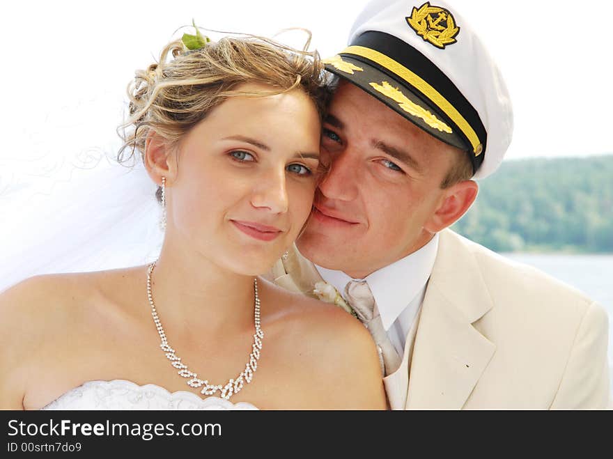 Bride and groom posing to camera. Bride and groom posing to camera