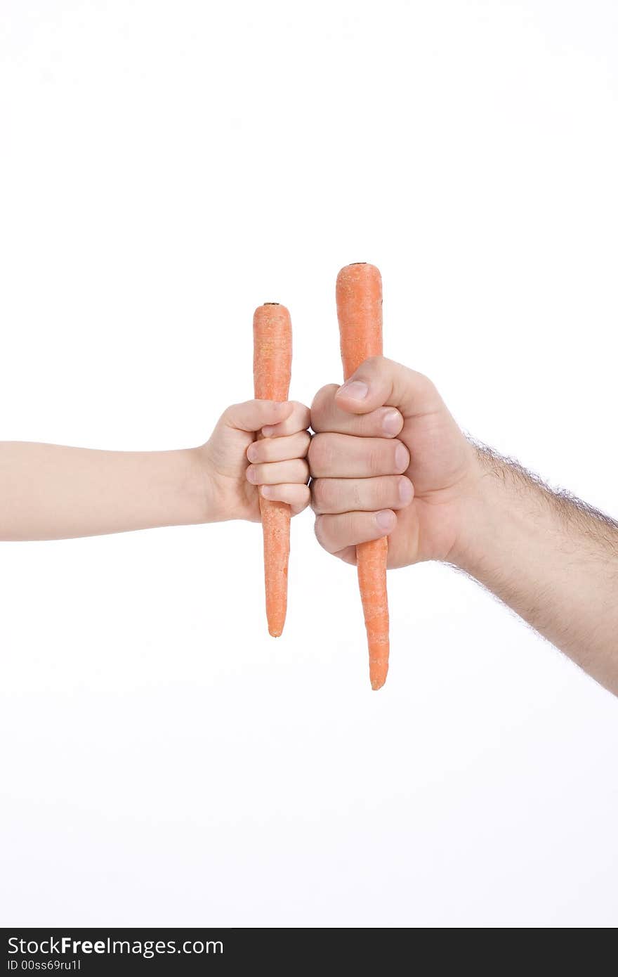 Father and son take a carrot